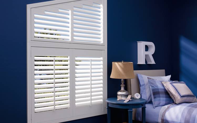 Blue bedroom with shutters